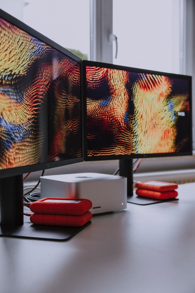 a computer monitor sitting on top of a desk