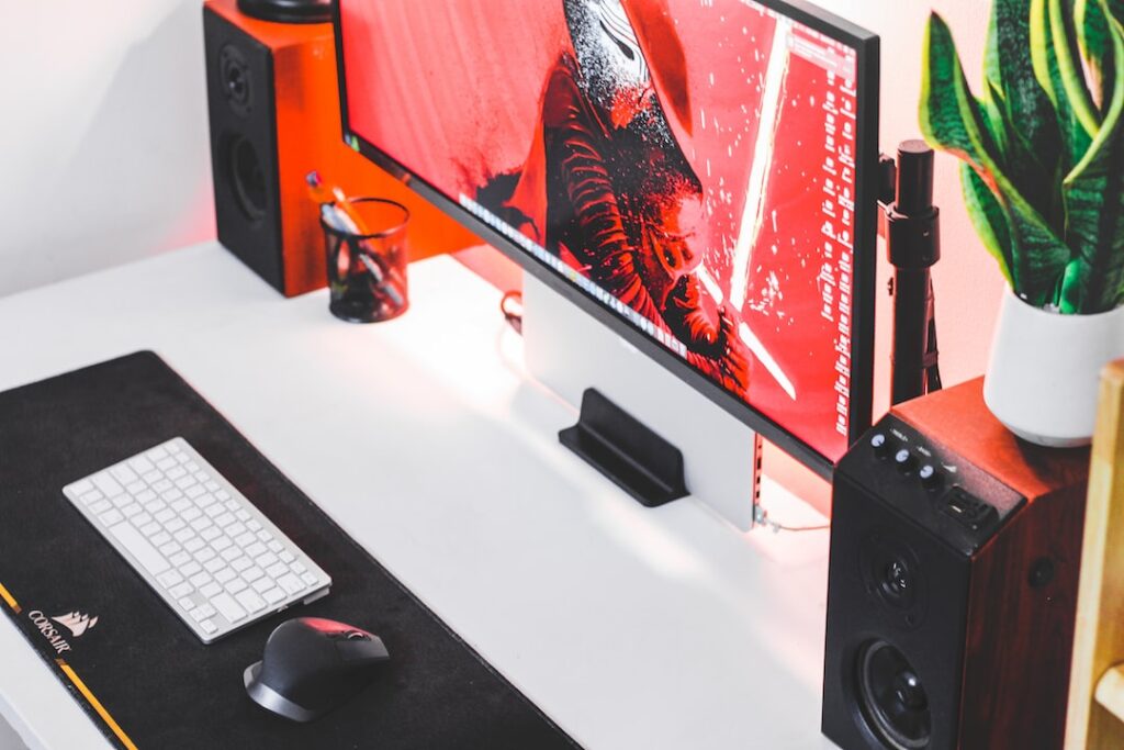 a computer monitor sitting on top of a desk