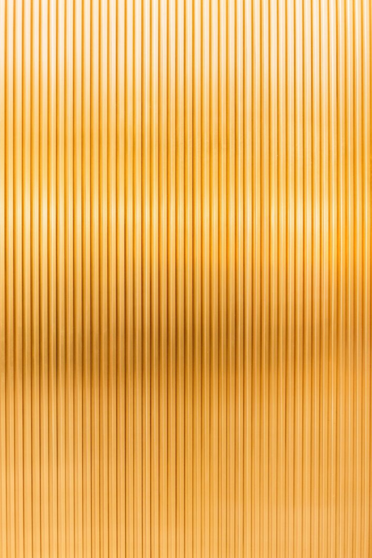 a gold metallic background with vertical lines