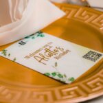 a gold plate with a napkin on top of it