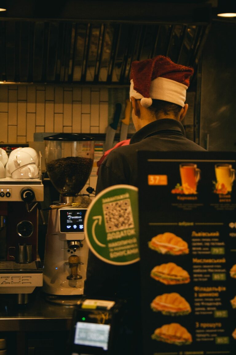 a man standing in front of a coffee machine