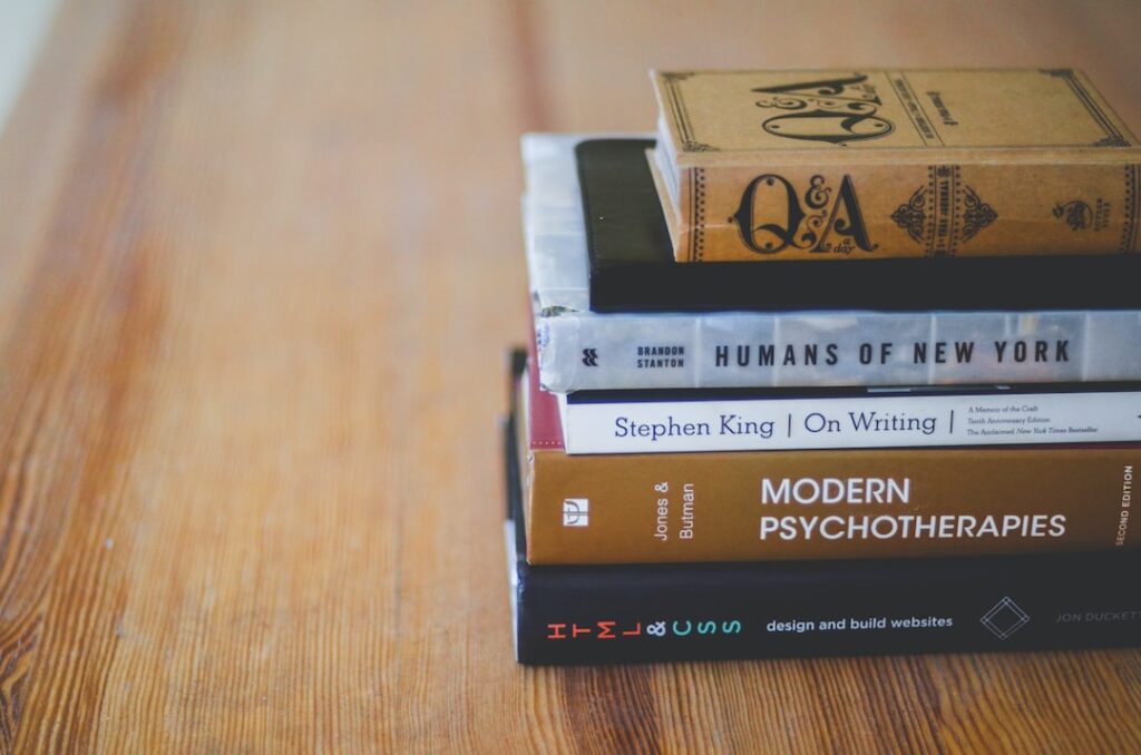 assorted reading books on table