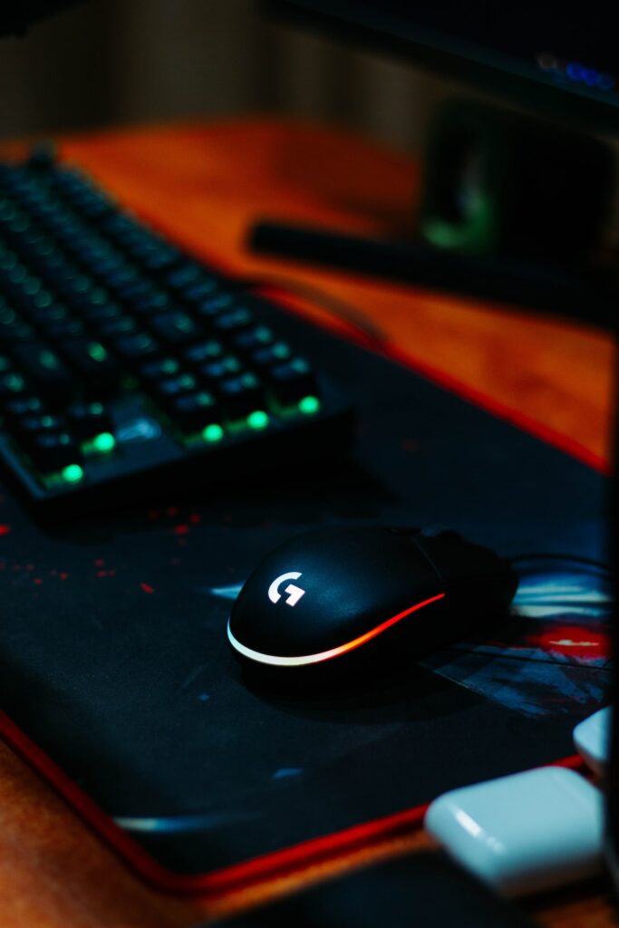 black logitech cordless computer mouse on black mouse pad