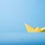 closeup photo of yellow paper boat