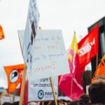 group of people holding signages