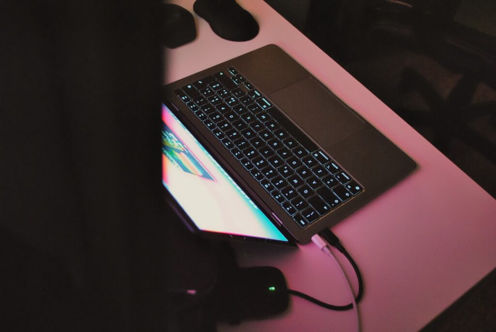 macbook pro on white table