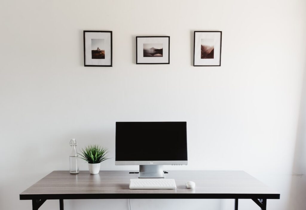 monitor, keyboard, and mouse on table