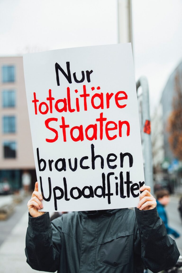 person holding white signboard