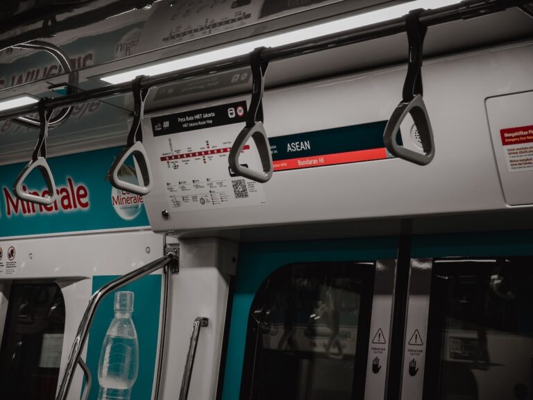 the inside of a subway car with the door open