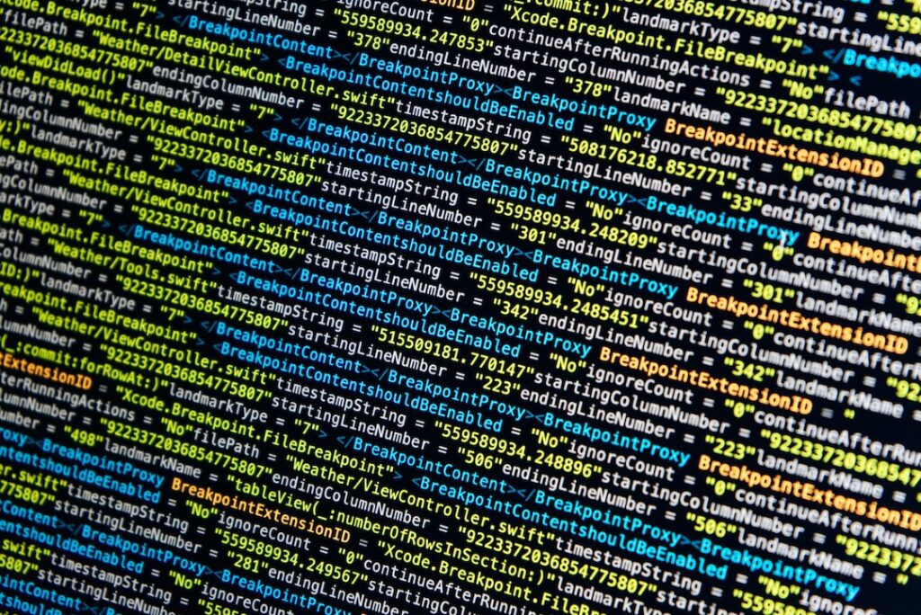 turned-on monitor displays source codes